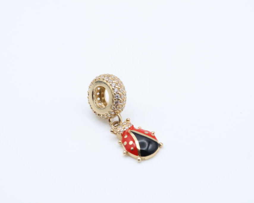Dijes Mariquita 14kt zirconia Weight 1.4g